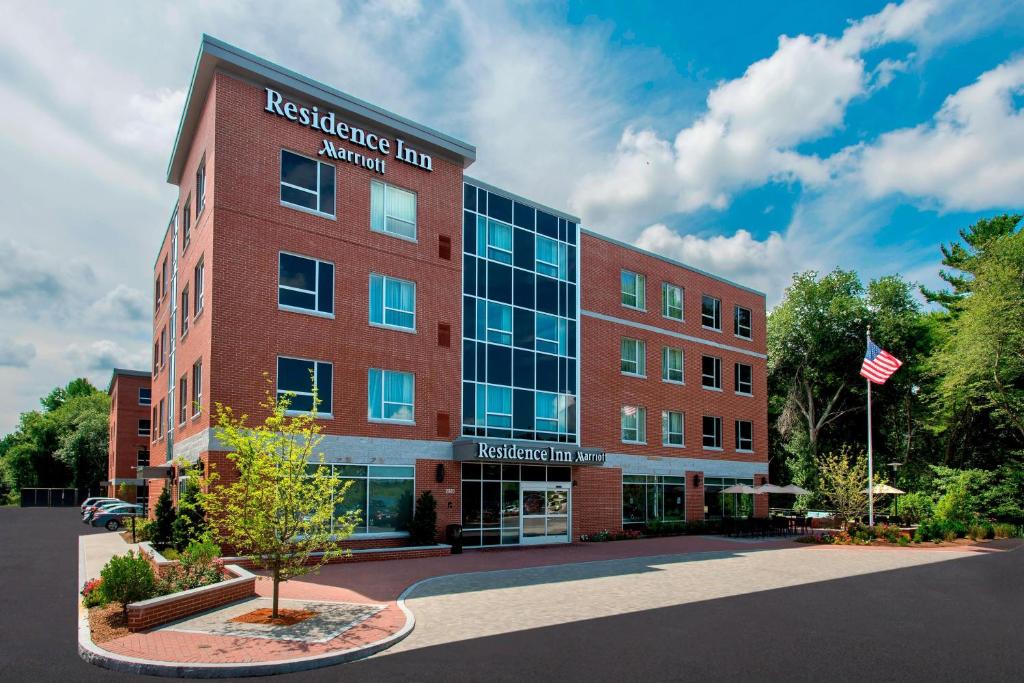 A regal brick hotel building on a sunny day. 